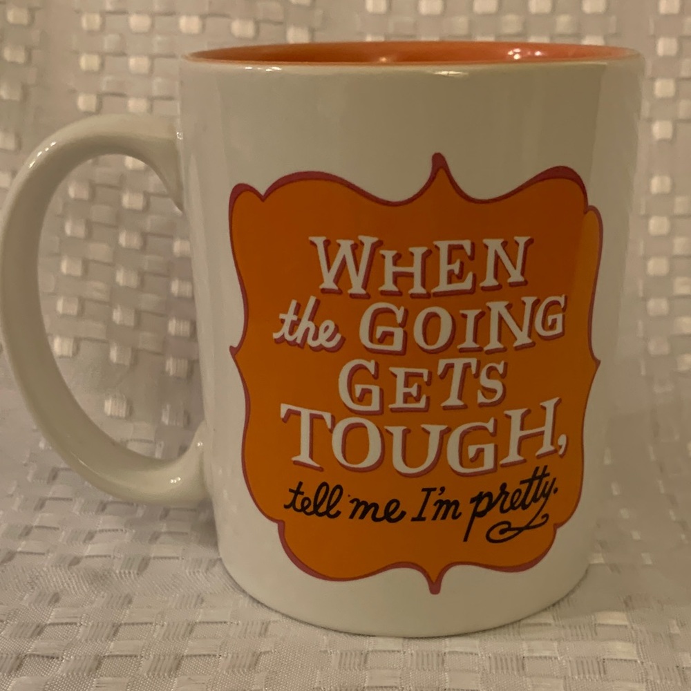 Funny motivational mug, white and peach, almost 4 inches tall.